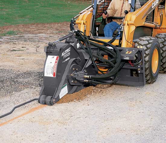 A pavement saw attachment on a skid steer.